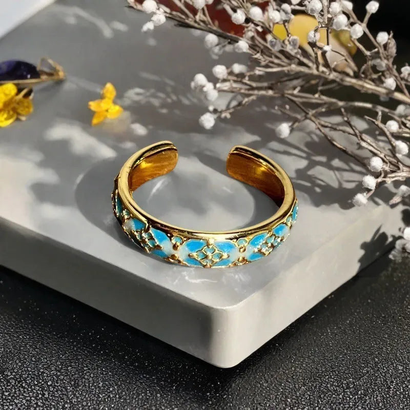 Adjustable copper women's ring with vintage oil drip finish, gourd shape, and inlaid zircon stones in floral and bow designs.