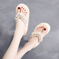 Women's high-heeled flip-flops in beige with cotton cloth upper, showing casual summer sandal design