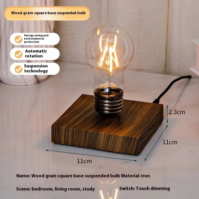 Iron art suspension bulb night lamp on a black wood grain base