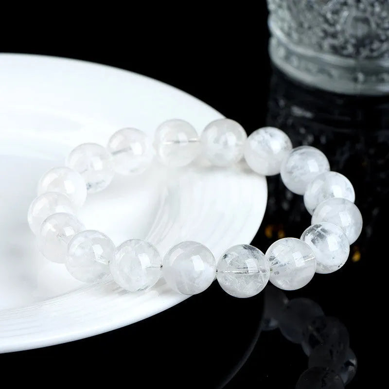 Crystal women's bracelet with natural blizzard snowflake round beads in geometric design featuring Ruyi and Xiangyun elements