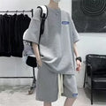 Men's waffle-textured leisure sports suit set with short sleeve top and matching shorts in cotton polyester blend fabric
