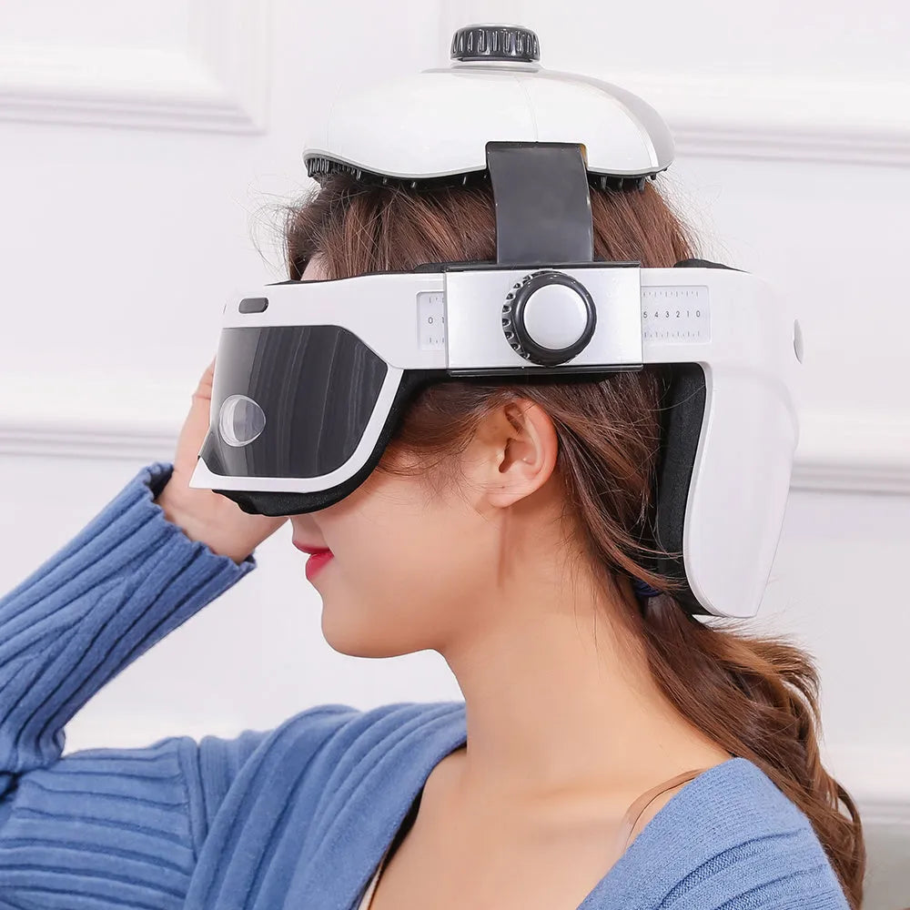 Electric eye massager in white and black with adjustable headband and LCD remote
