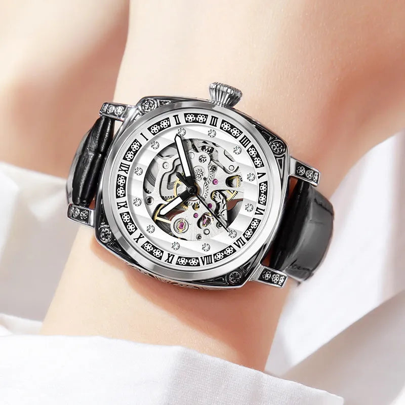 Mechanical watch with luminous numerals on a leather strap, shown in multiple colour options.