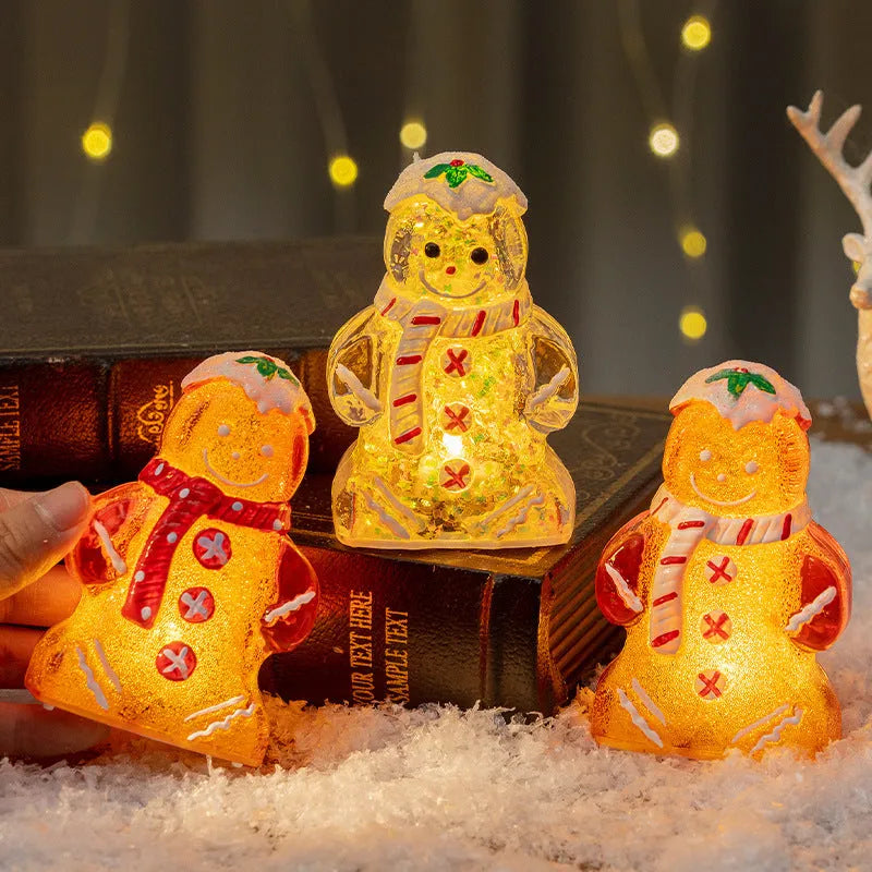 Glowing red-scarf gingerbread man Christmas ornament with modern design on a green tree branch.