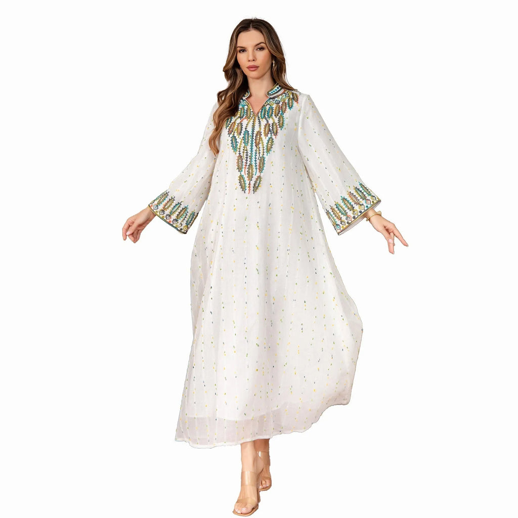 White Dubai-style Arabic robe with long sleeves and full-length skirt on hanger