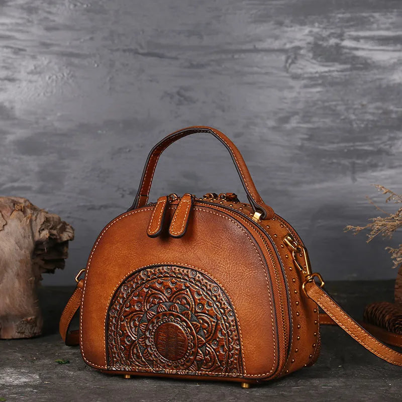 Vintage suede cowhide leather handbag showing internal ID pocket, phone pocket, and zipper compartments.