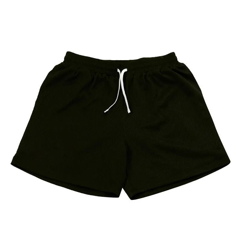 Men's solid colour mesh quick-drying shorts in black, shown flat.