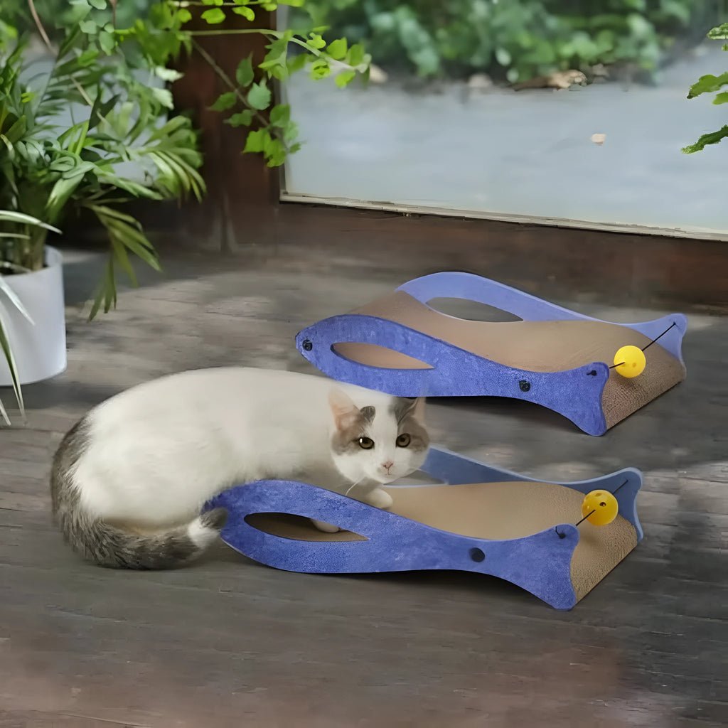 Blue fish-shaped cardboard cat scratcher lounge with a hanging ball toy for cats.