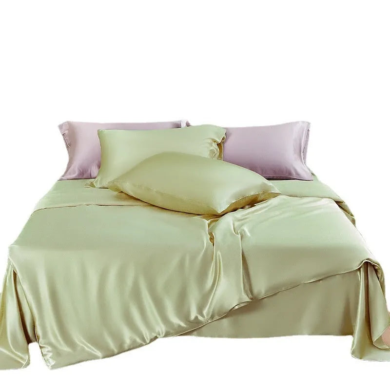 Double-sided silk duvet cover in a solid colour, shown in bright brown on a bed.