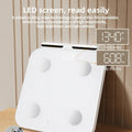 White professional body fat scale with 8 electrodes, LED display, and USB charging port