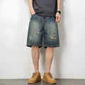 Blue retro loose hole denim shorts for men on a white background
