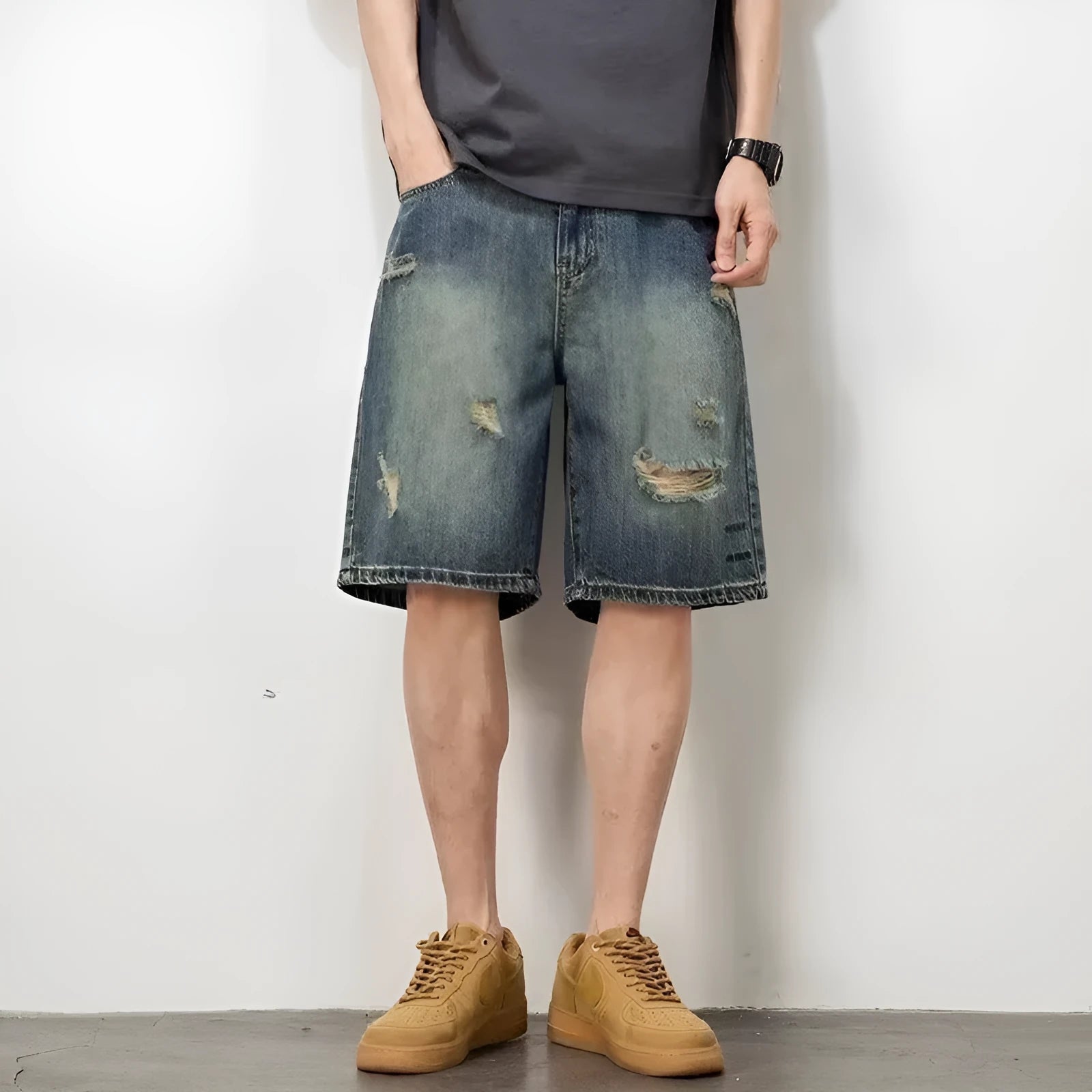 Blue retro loose hole denim shorts for men on a white background