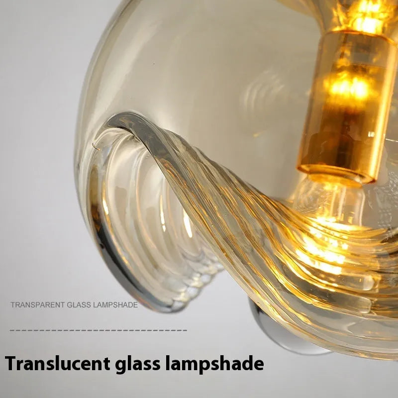 Modern minimalist glass bedside chandelier with a 250mm diameter, shown in a transparent light colour option.