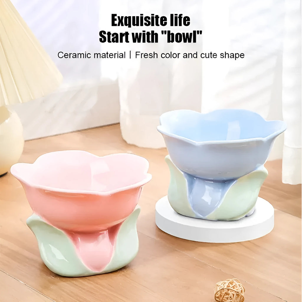 Blue ceramic elevated pet feeding bowl with floral pattern and non-slip base