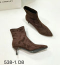 Black pointed toe stiletto heel ankle boots with a calf-high shaft on a neutral background.