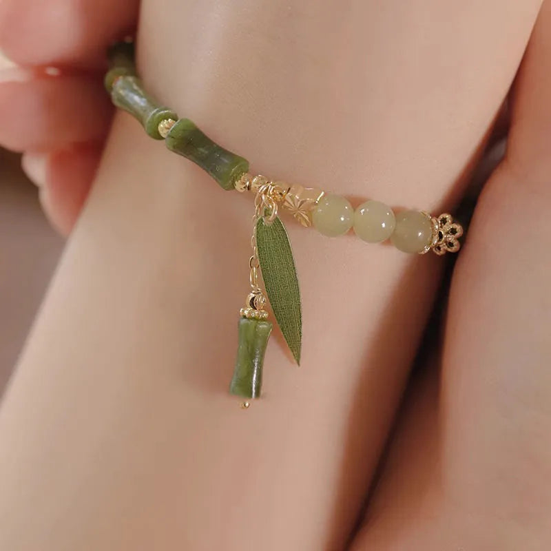 Chinese style bamboo leaf glass bracelet for women with a bamboo joint design.