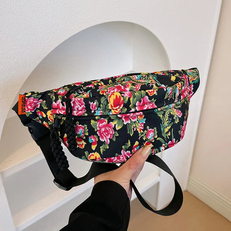Western-style women's waist bag with large flower design and three-dimensional pockets.