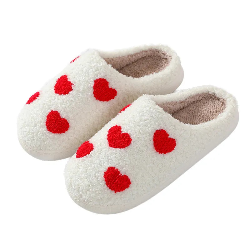Plush cartoon love style slippers for women with non-slip PVC soles in multiple colours.