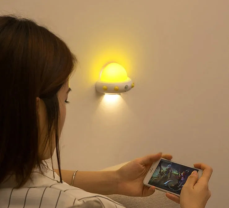 Remote control UFO shaped bedside night light in white, blue or pink colours