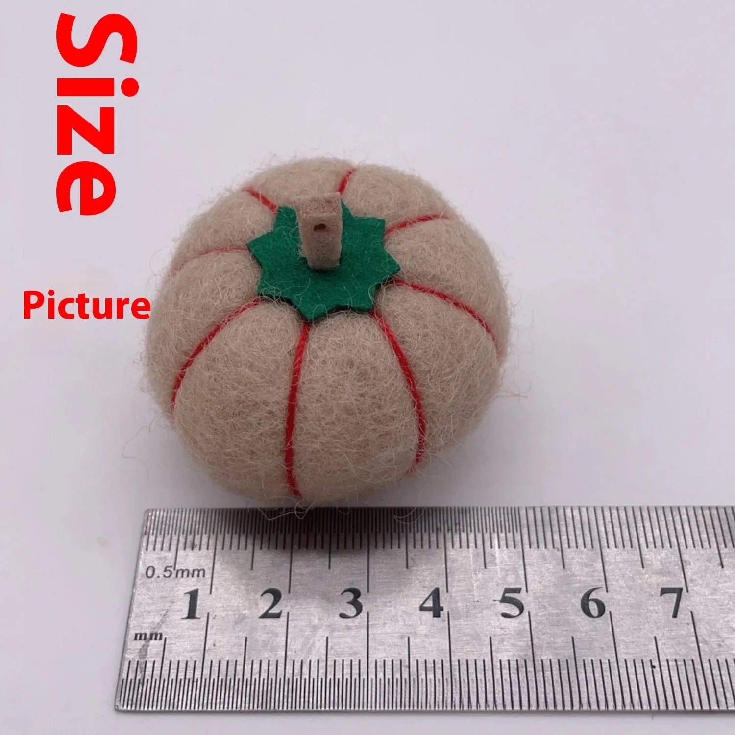 Wool felt pumpkin ornament decorations in autumn colours for seasonal displays