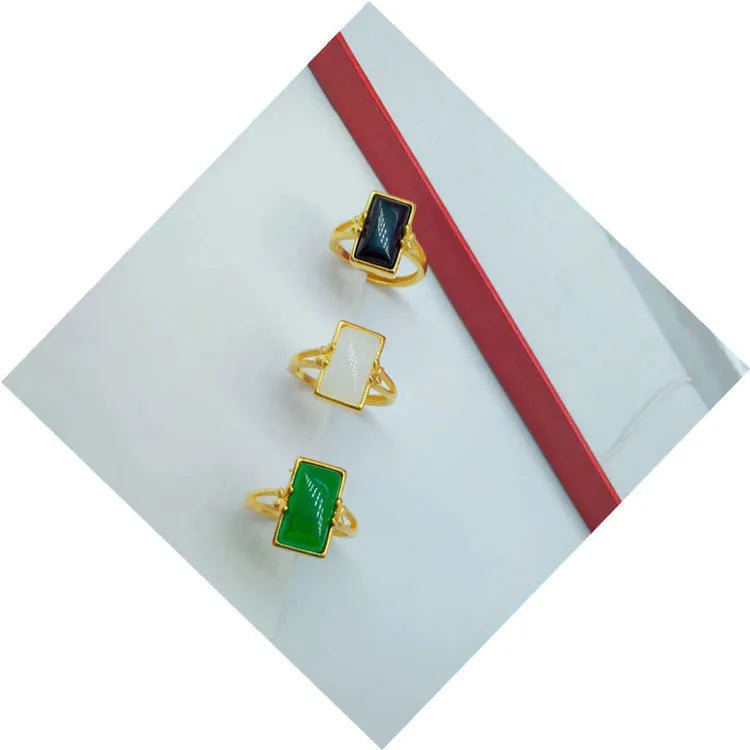 Brass gold-plated adjustable ring with long artificial gemstone in green, white, or black colour option