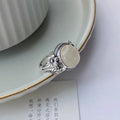 Copper adjustable ring with imitation white chalcedony stone in vintage U-shaped design