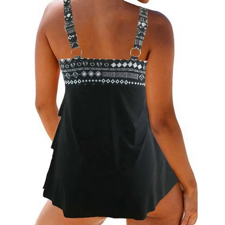 Women's plus-sized split swimsuit with double shoulder straps and a decorative bow.