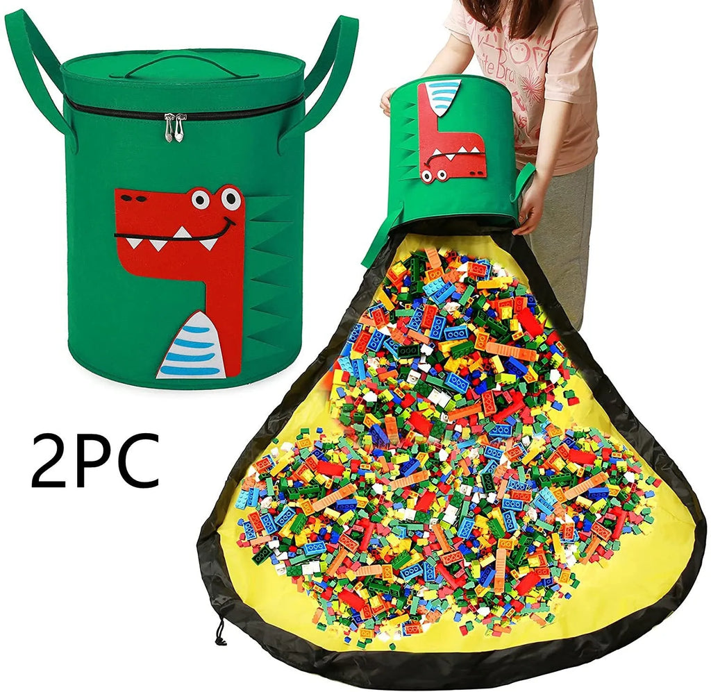 Green felt cube storage bag with pull rope open as a floor play mat for toys.