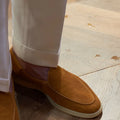 British handmade brown leather loafers for men on a white background