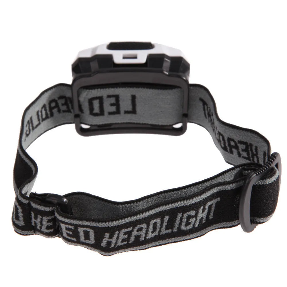 Black cat eye design LED headlamp head torch with white and red lights on an adjustable strap.