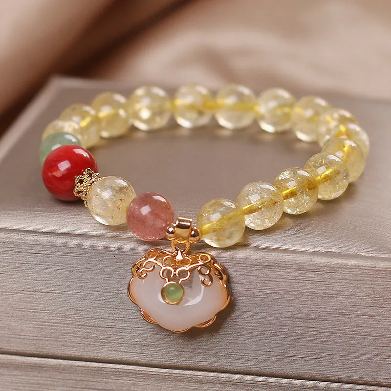 Women's alloy bracelet with a yellow citrine jade ruyi pendant charm.