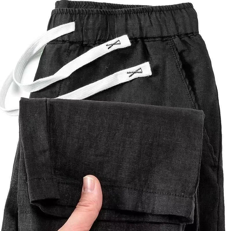 Linen drawstring trousers in straight leg cut showing apricot colour option
