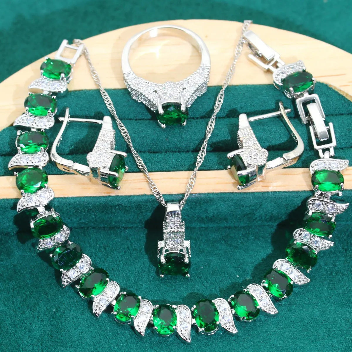 Four-piece bridal jewellery set with water wave chain necklace, bracelet, earrings, and ring in alloy with zircon detailing