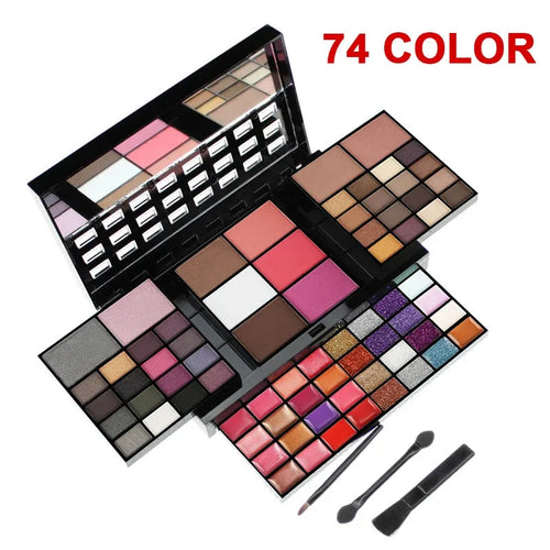 Open 74-colour makeup palette showing four layers of eyeshadow, lip gloss, blush, and contour powders with included brushes.