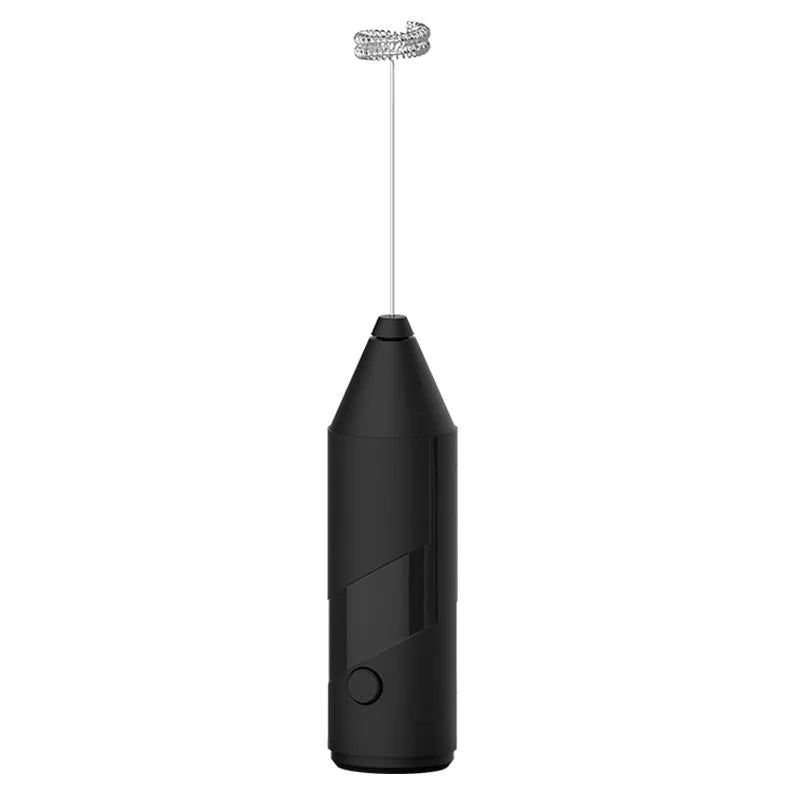 Compact black handheld milk frother with stainless steel whisk on a kitchen counter.