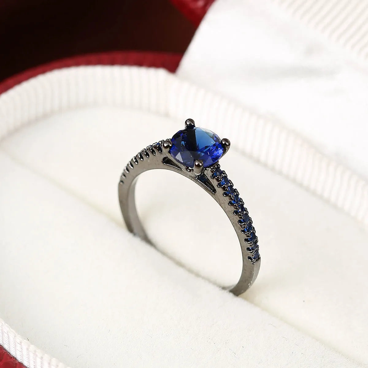 Hexagonal geometric zircon ring in copper with electroplated finish showing angular design and zircon stone