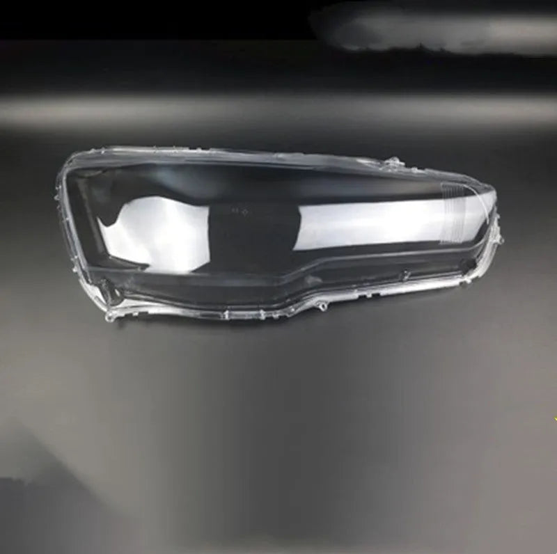Transparent plastic headlight housing cover for vehicle lighting protection