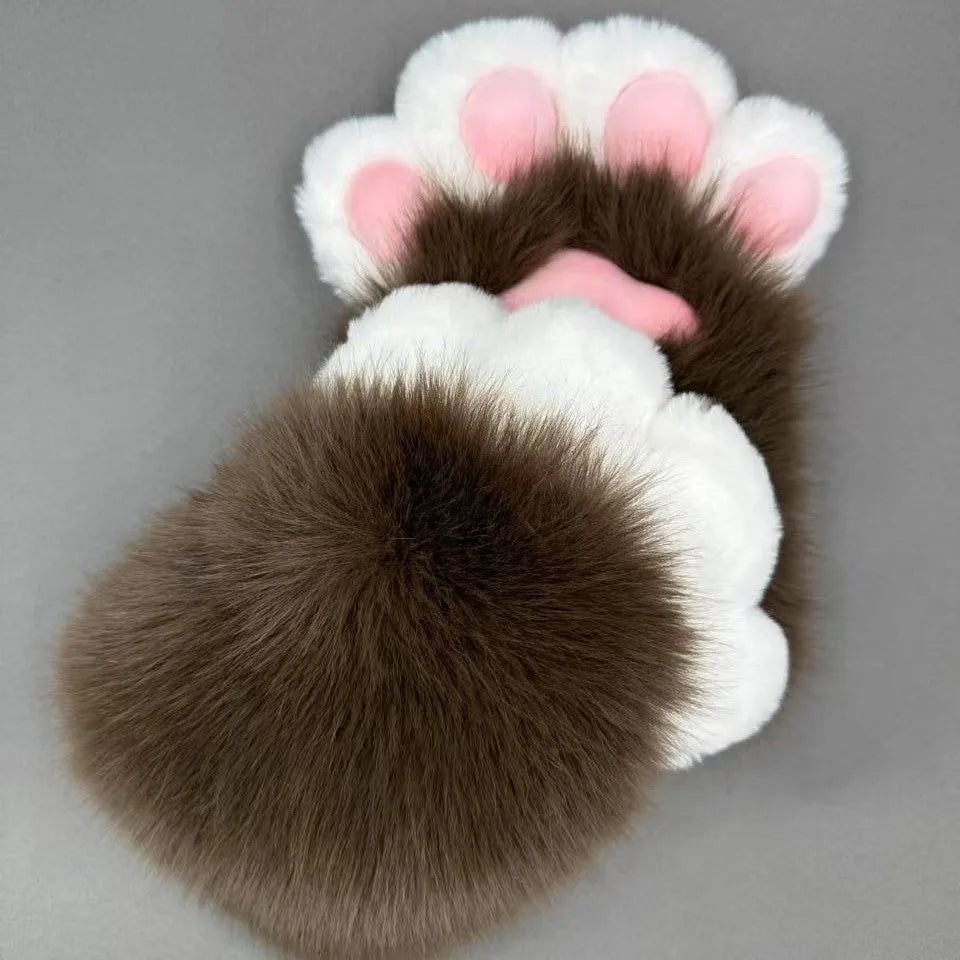 A pair of fingerless animal claw cosplay gloves in a white and pink colour combination with a coloured pad on the back.