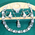 Four-piece bridal jewellery set with water wave chain necklace, bracelet, earrings, and ring in alloy with zircon detailing