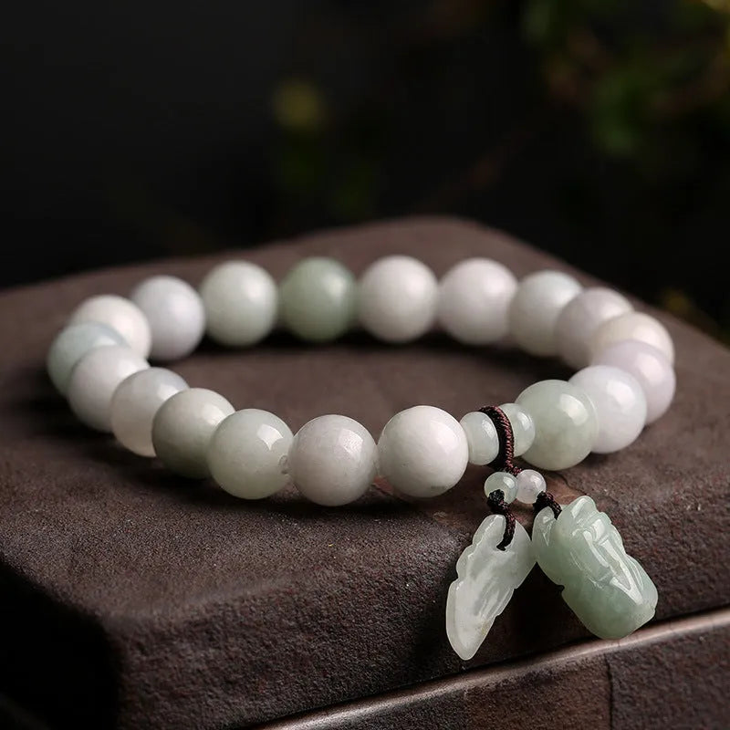 Natural jade hanging bracelet with carved pendant showing geometric design