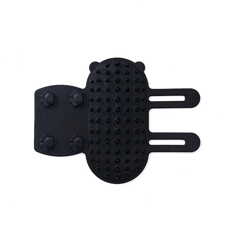 Silicone cat grooming and scratching brush with adjustable strap wrapped around a table leg.
