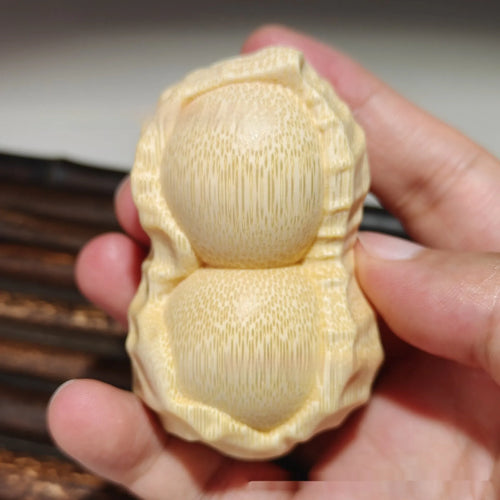 Natural solid bamboo peanut ornament with carving detail and modern simple style