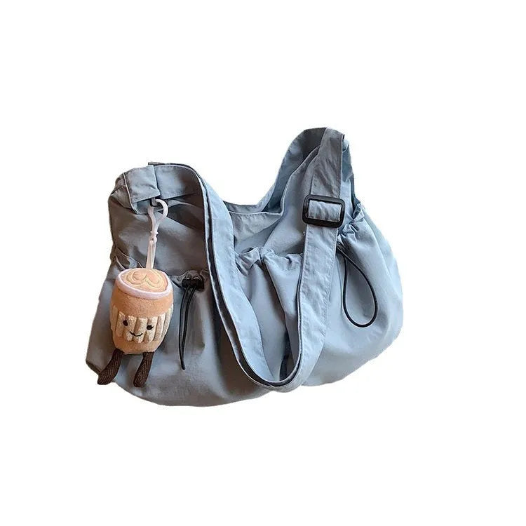 Ultra-light pleated crossbody student cloth bag in green with folding design and phone pocket