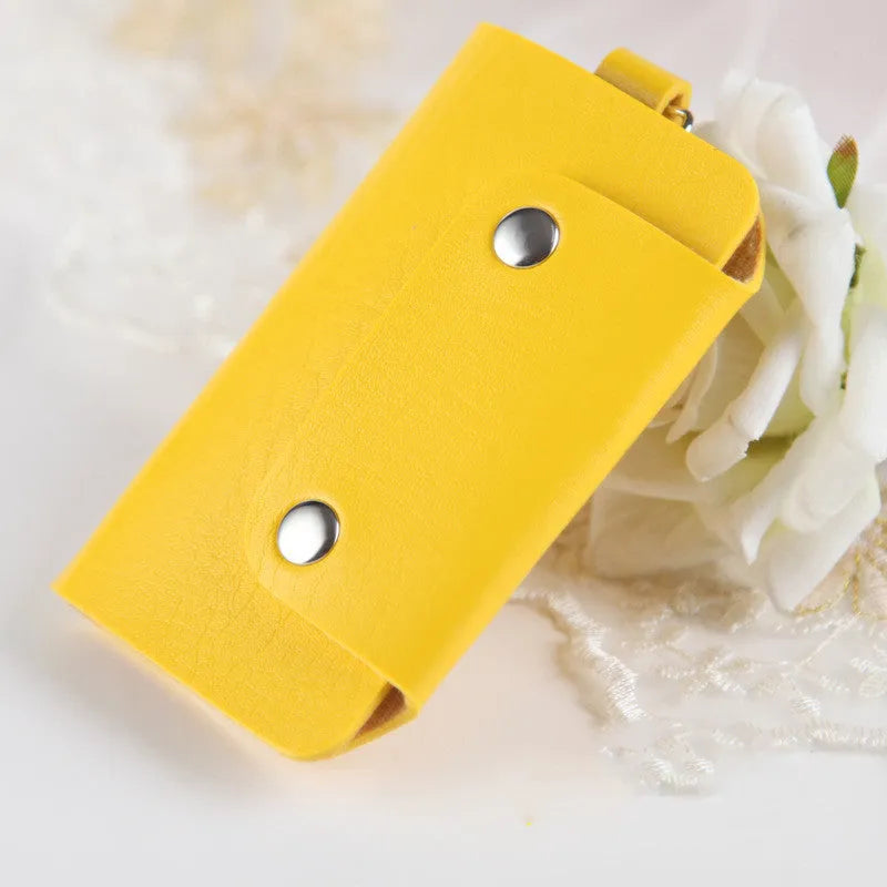 Soft PU leather colour button key case in square vertical section with key bit and cover opening in plain Korean style