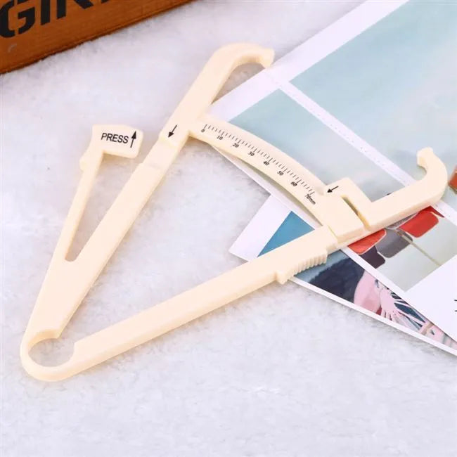 Acrylic body fat caliper skin fold thickness measuring instrument showing measurement scale