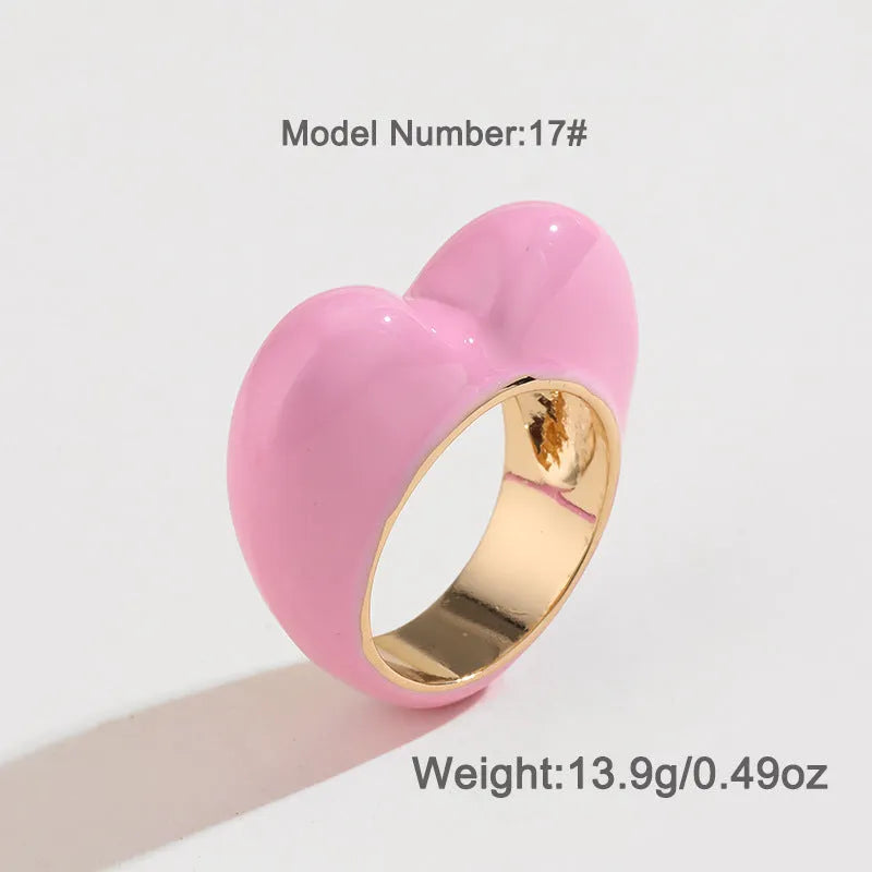 Colourful three-dimensional enamel heart ring on a zinc alloy band.