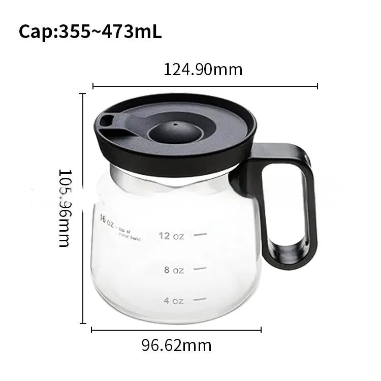 Transparent borosilicate glass coffee jug with black silicone cover on a kitchen counter