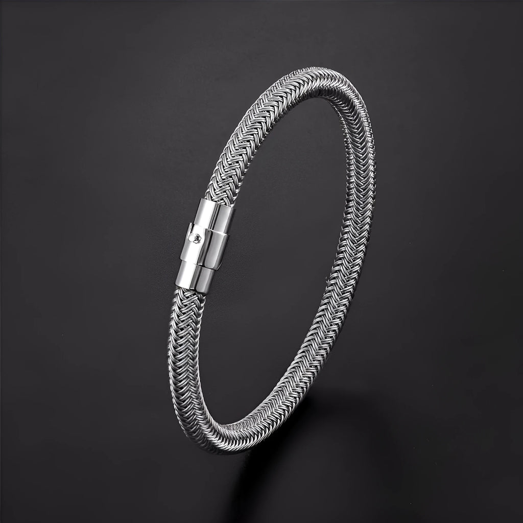 Titanium steel geometric wire bracelet with a magnetic clasp and charm socket.