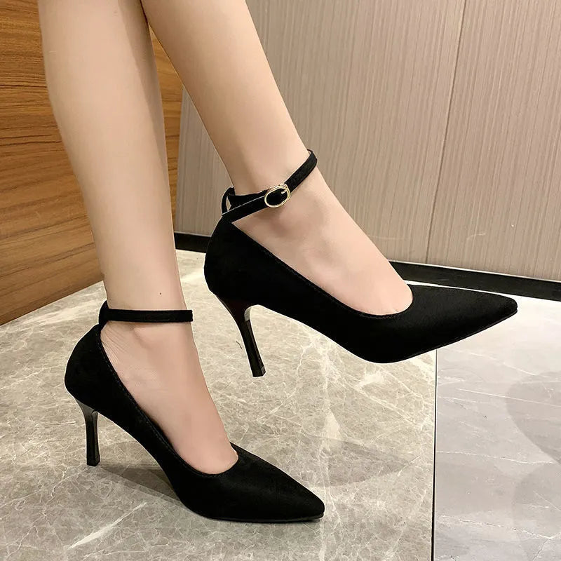 Women's black and creamy white stiletto heel pumps with buckle detail in 8cm and 5cm heel heights