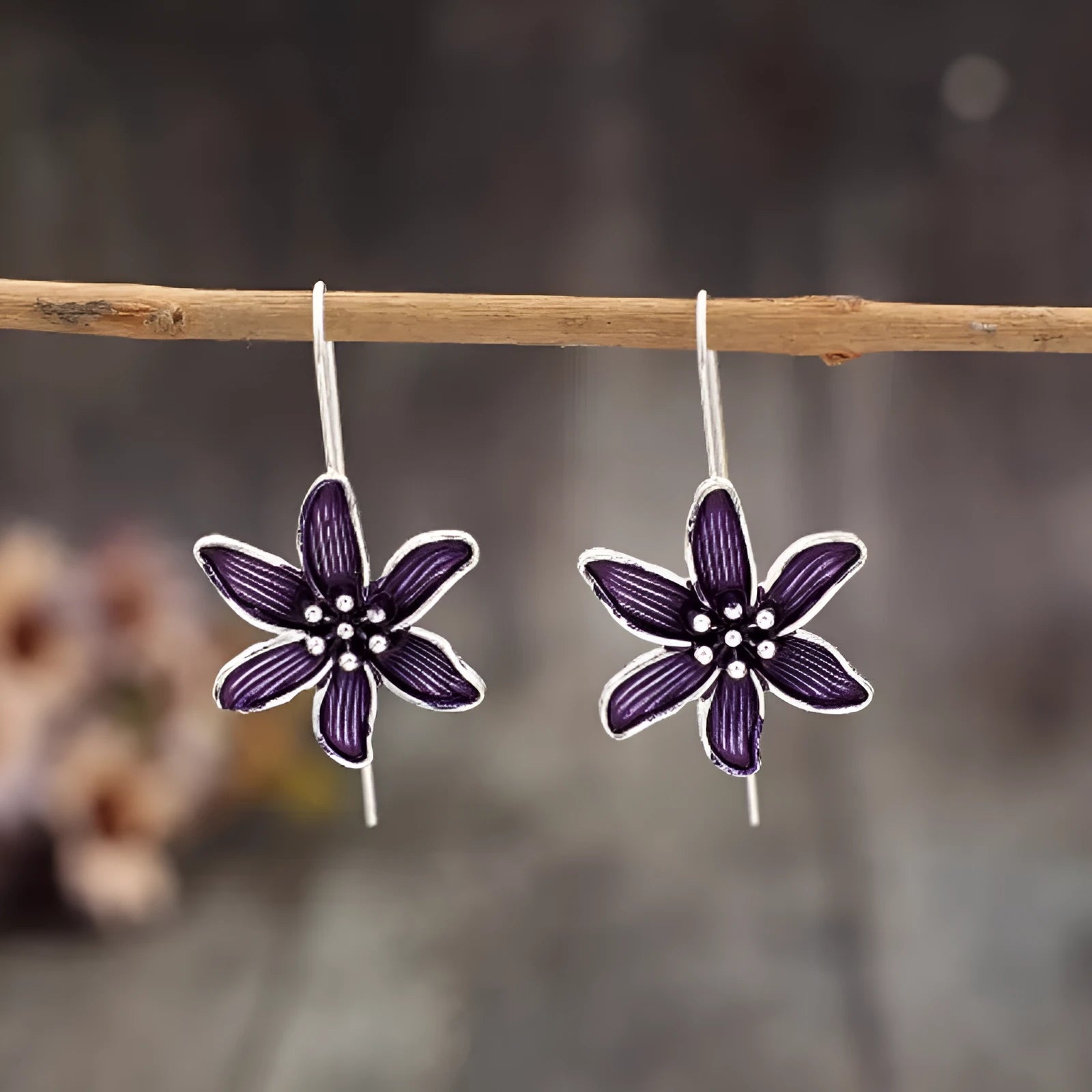 A pair of retro-style purple flower earrings made from lightweight alloy with an electroplated finish.
